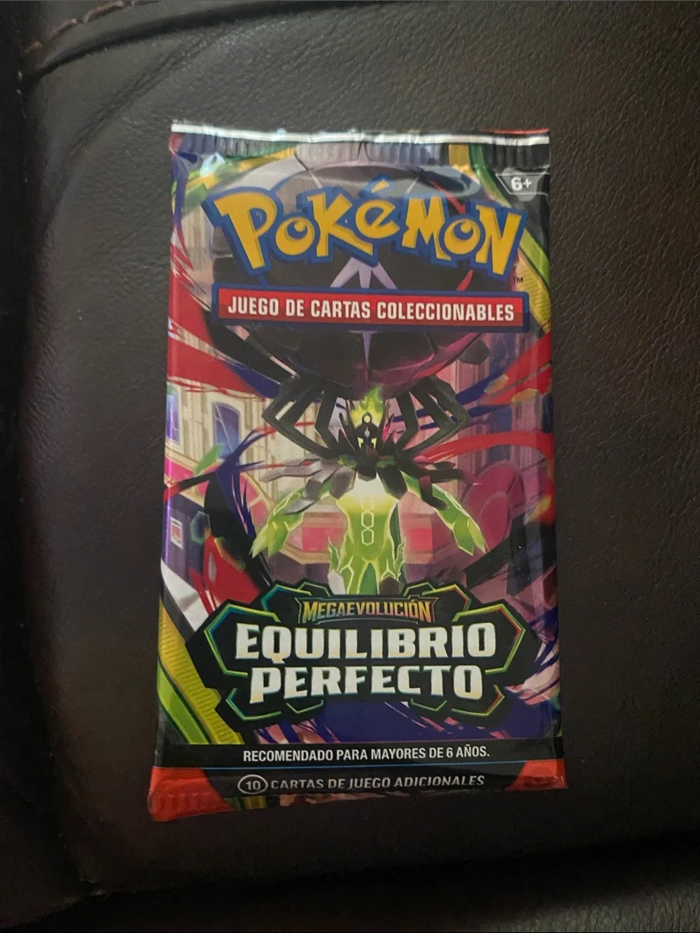 Pokemon trading card booster pack - green, red, purple
